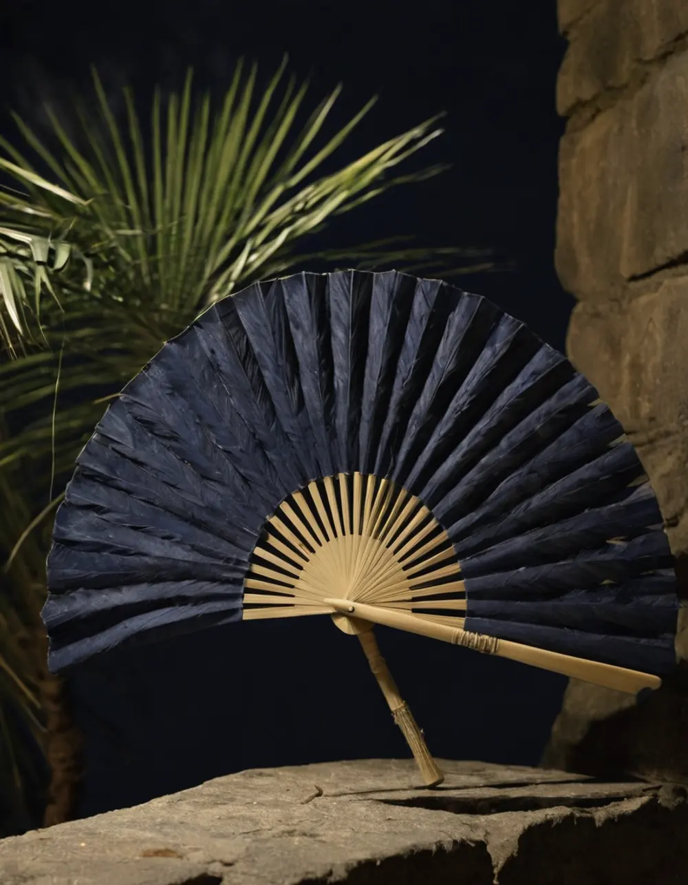 Purva Ashadha: palm-leaf fan on a stone ledge at night
