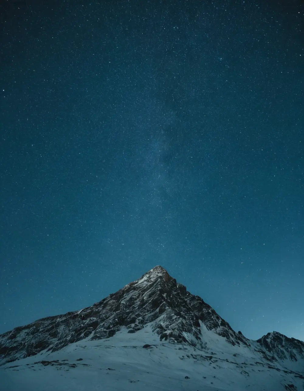 Snowy peak under a clear night sky